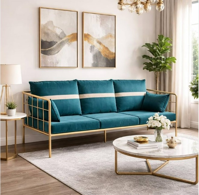 Teal sofa with gold frame in bright living room